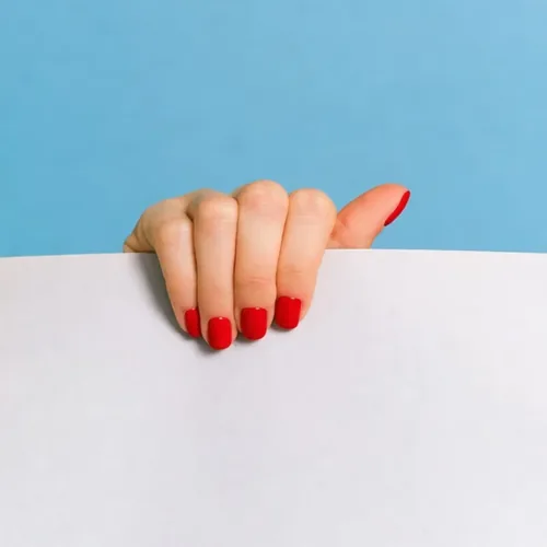 AI photo editor result — Change Color: Make the nails red.