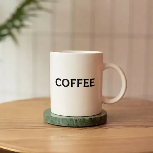 AI photo editor result — Text & Detail: Print COFFEE on the mug.